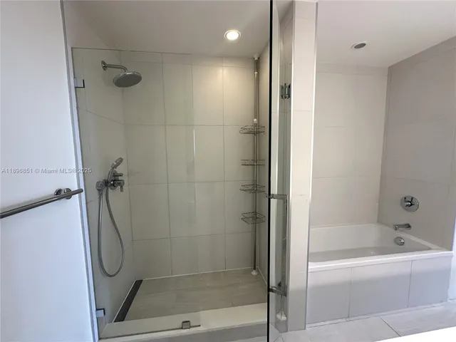 a bathroom with a sink toilet and mirror