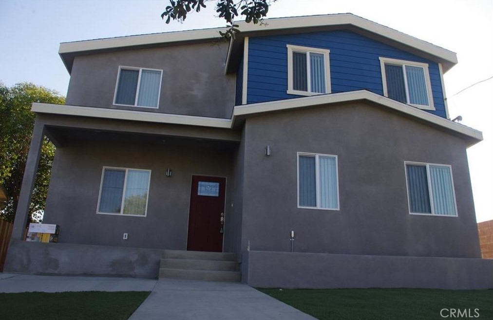 2816 East 3rd Street Los Angeles, CA 90033 - Photo 1 of 8 a house that has lot of windows in it
