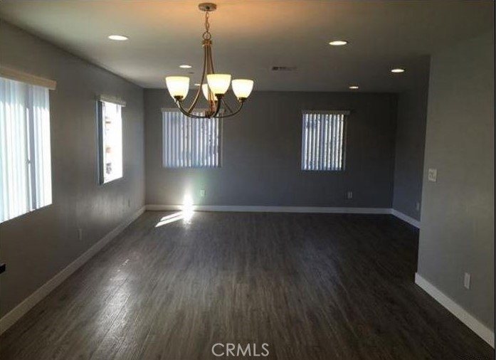 2816 East 3rd Street Los Angeles, CA 90033 - Photo 4 of 8 an empty room with wooden floor and windows