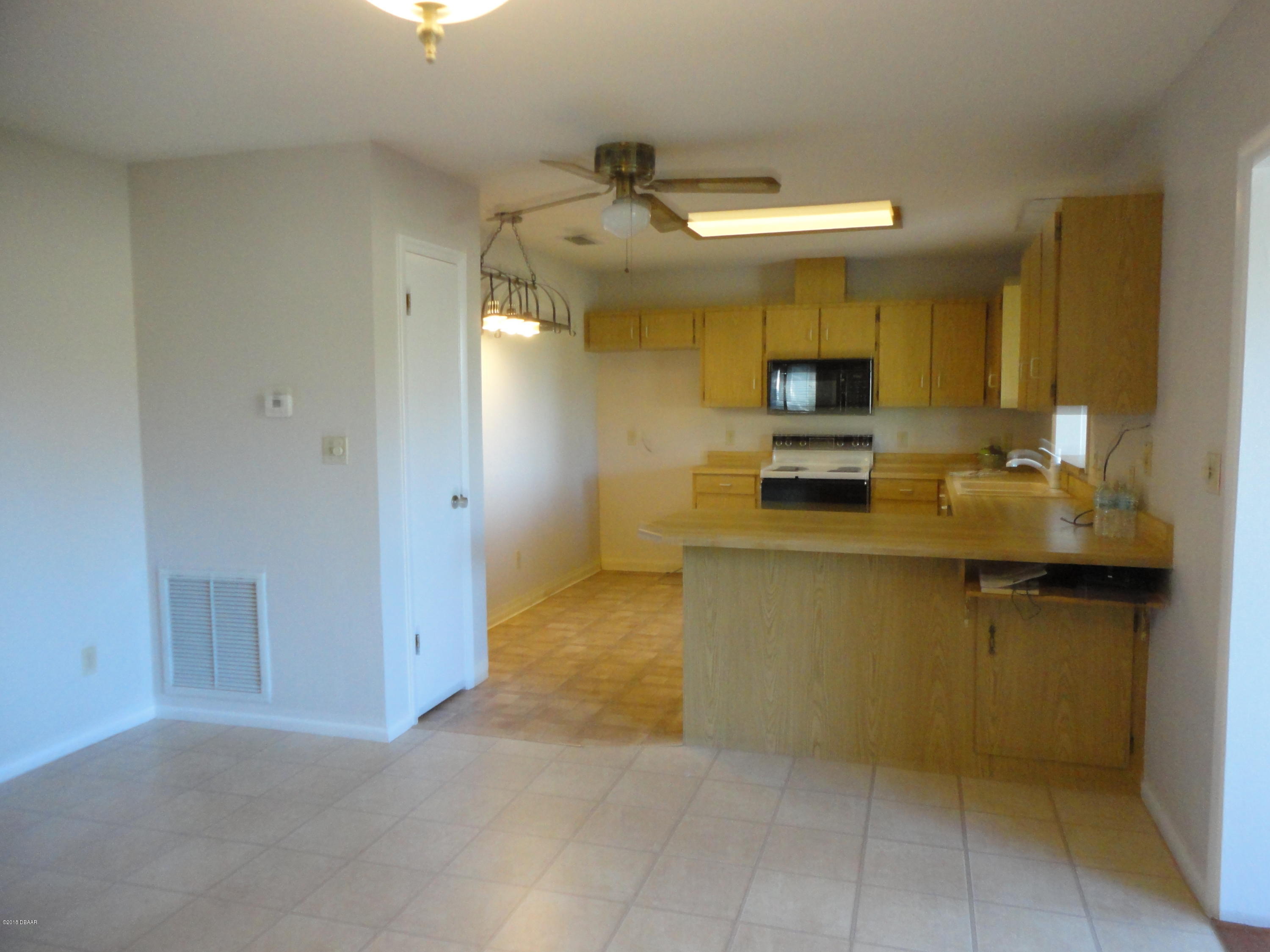 32 Crooked Pine Road Port Orange, FL 32128 - Photo 6 of 10 DINING TO KIT