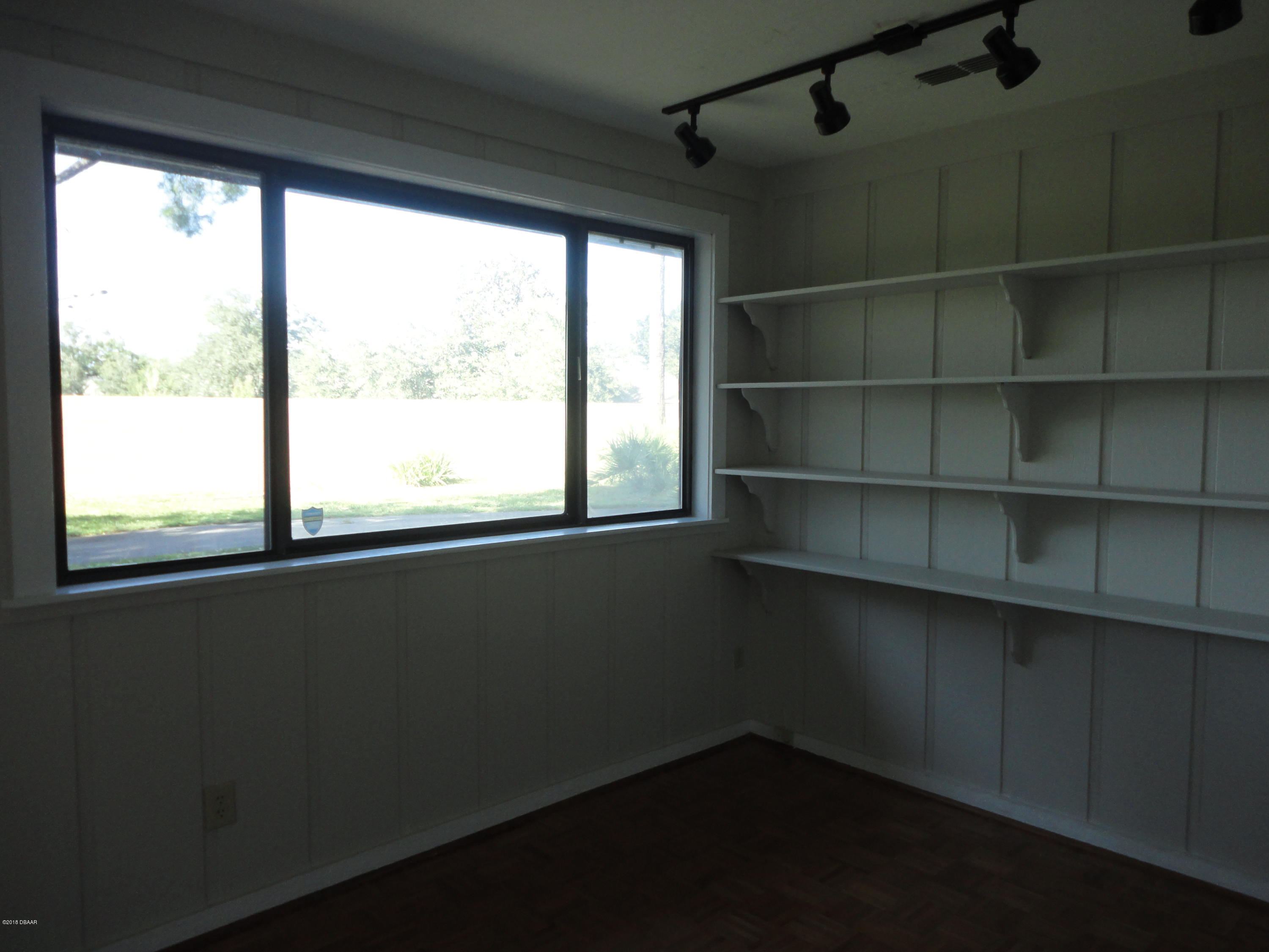 32 Crooked Pine Road Port Orange, FL 32128 - Photo 8 of 10 SHELVES IN FL ROOM
