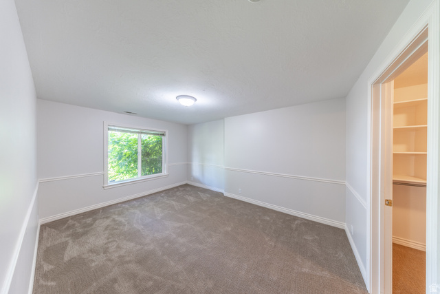 144 Bountiful Boulevard Bountiful, UT 84010 - Photo 28 of 28 Empty room with carpet flooring and baseboards