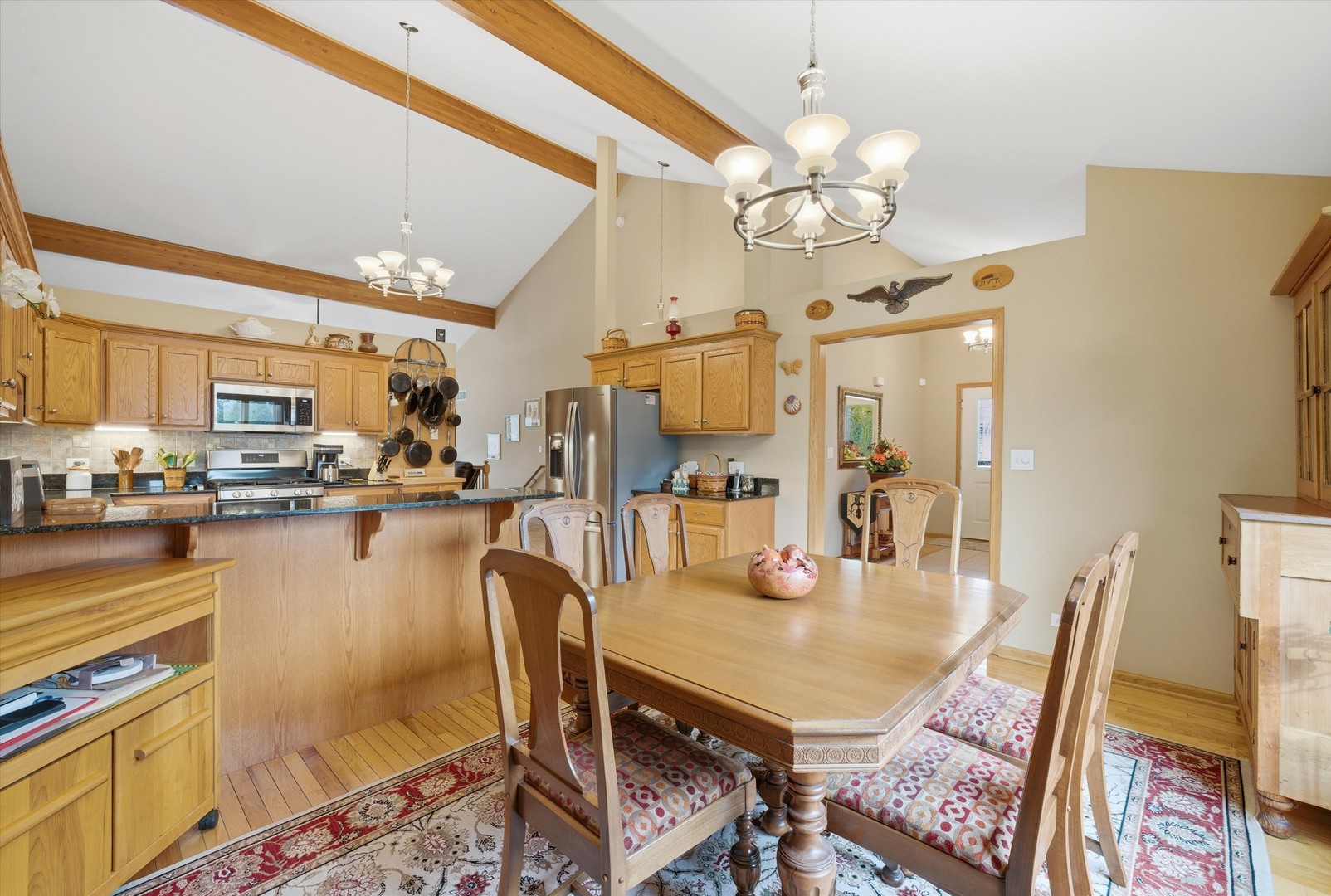 3688 Warwick Drive Crete, IL 60417 - Photo 12 of 27 a dining room filled with lots of furniture and chandelier