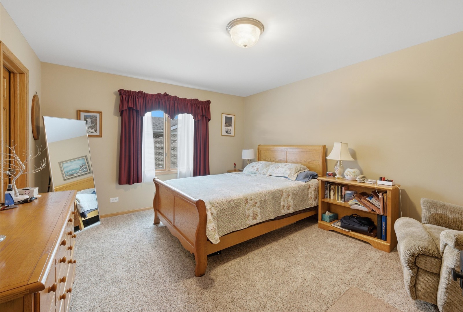 3688 Warwick Drive Crete, IL 60417 - Photo 16 of 27 a bedroom with a bed and a dresser