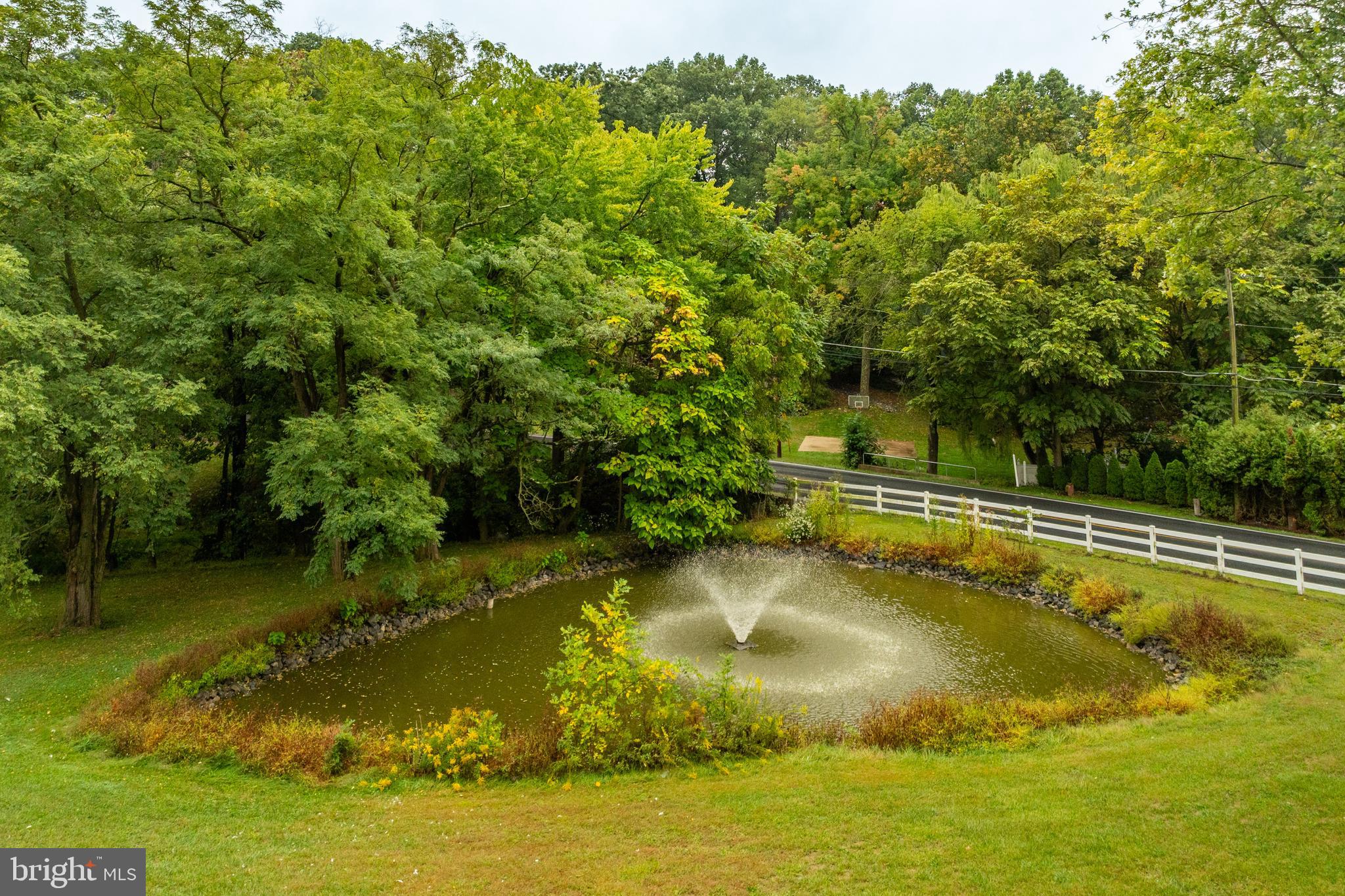 249 Landis Valley Road Lititz, PA 17543 - Photo 46 of 104 a view of a swimming pool with an outdoor space and seating area