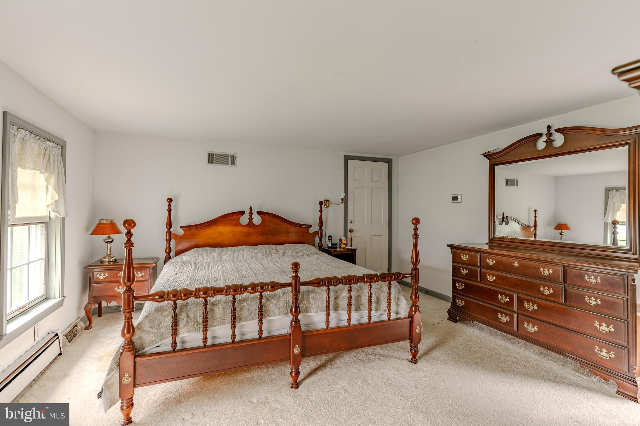 249 Landis Valley Road Lititz, PA 17543 - Photo 80 of 104 a bedroom with a bed and a dresser in it