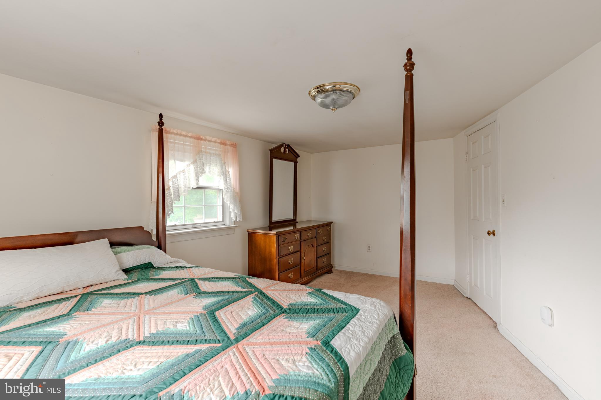 249 Landis Valley Road Lititz, PA 17543 - Photo 98 of 104 a bedroom with a bed and a table