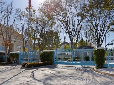 a view of a park with large trees
