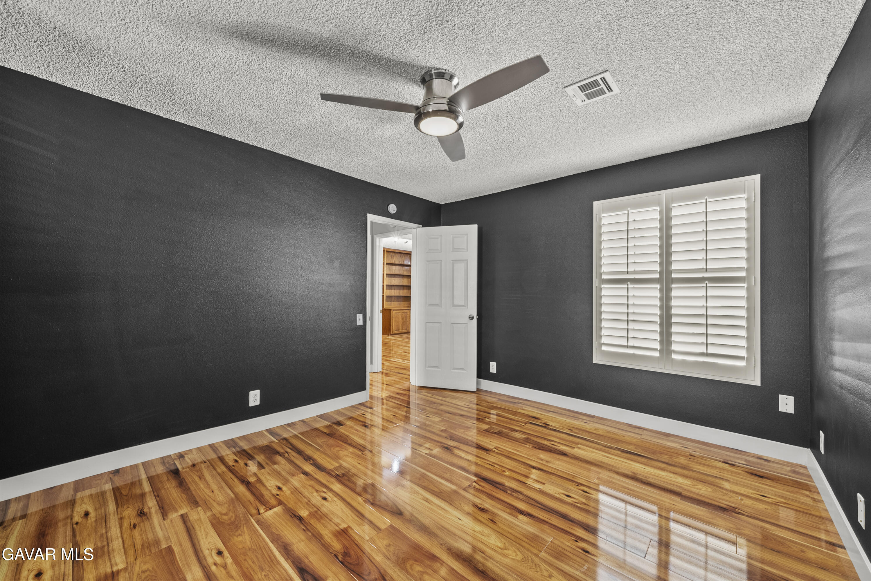 42805 15th Street West Lancaster, CA 93534 - Photo 19 of 27 a view of a livingroom with a ceiling fan and window