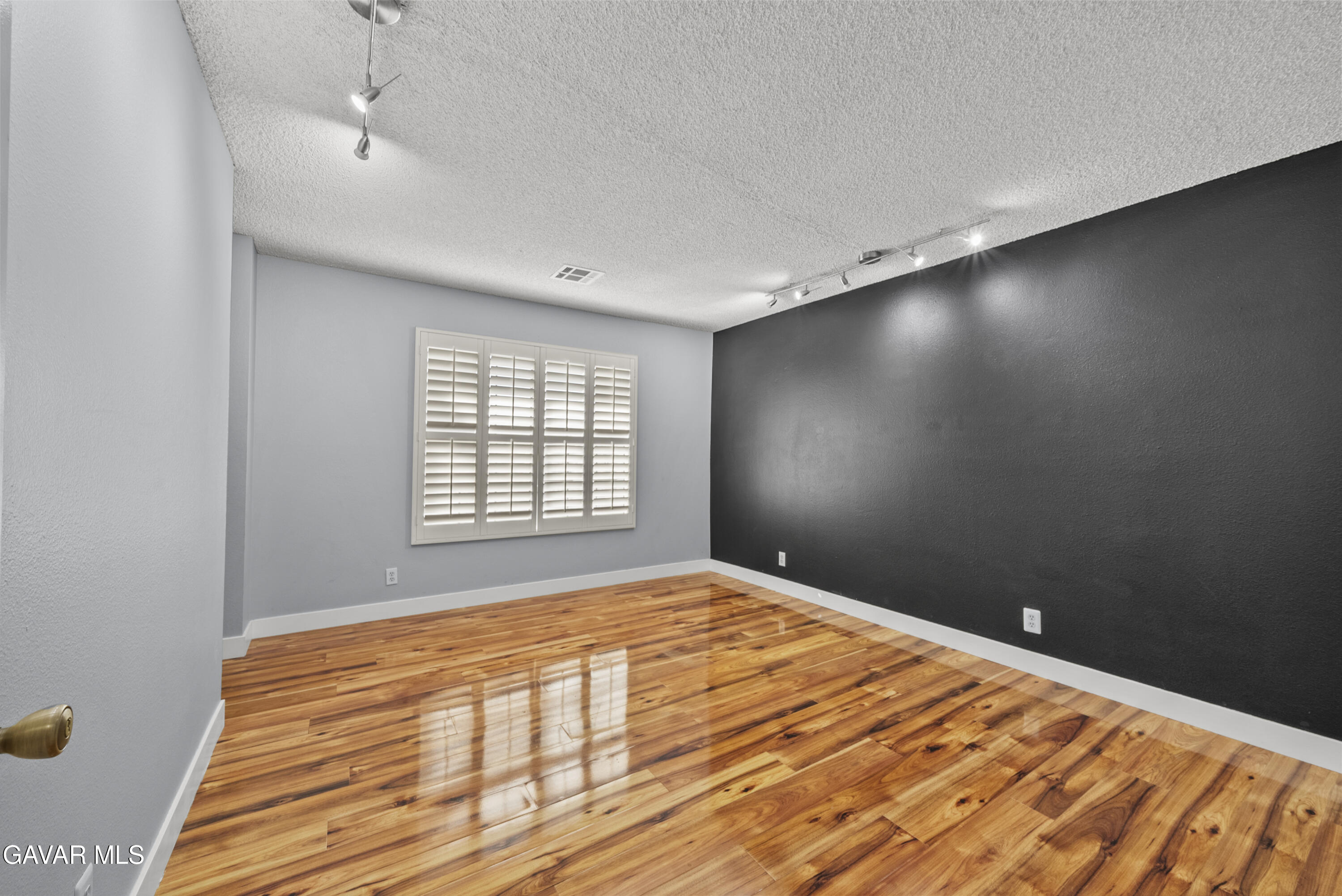 42805 15th Street West Lancaster, CA 93534 - Photo 22 of 27 a bedroom with a bed and a window