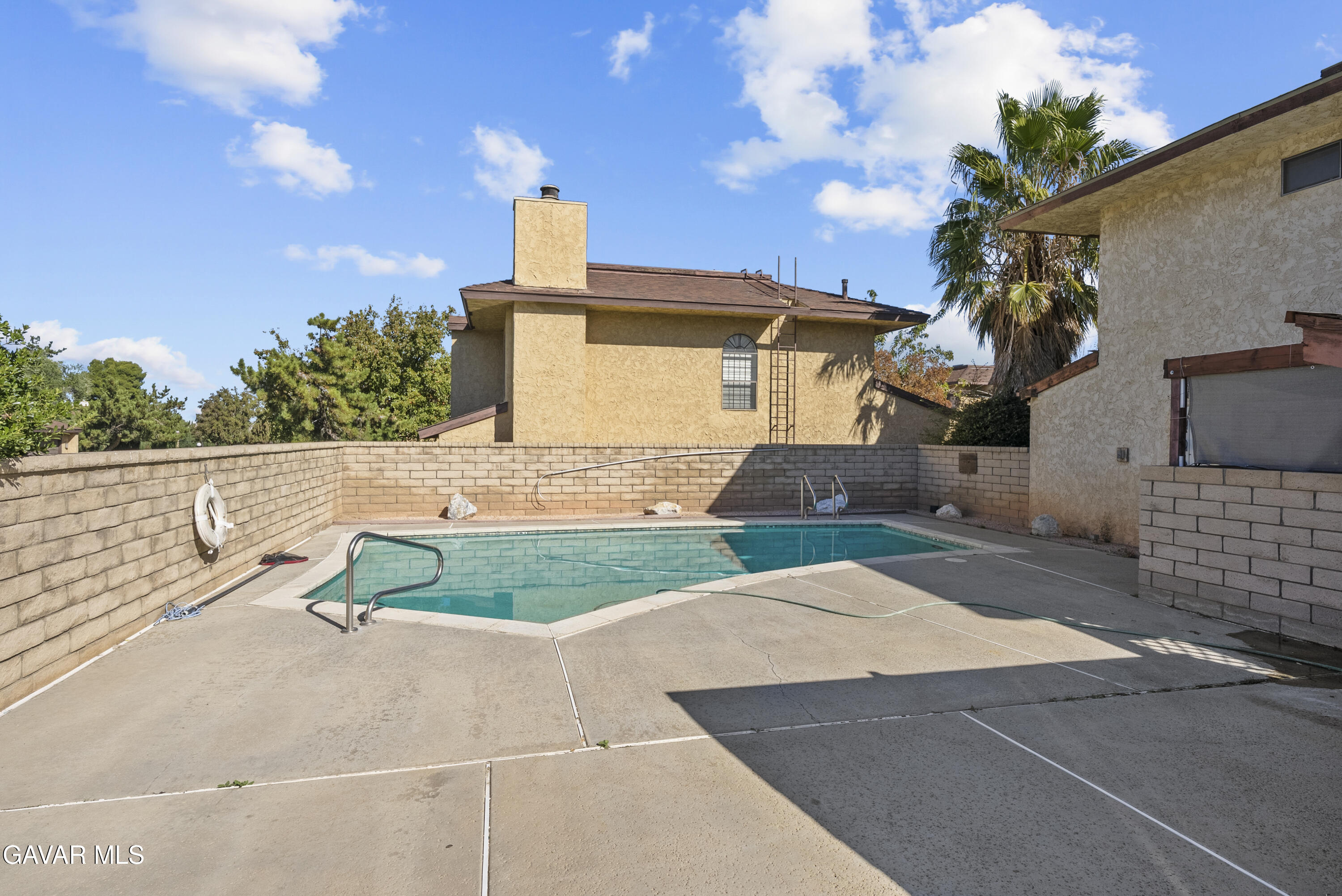 42805 15th Street West Lancaster, CA 93534 - Photo 26 of 27 a front view of a house with a yard and garage
