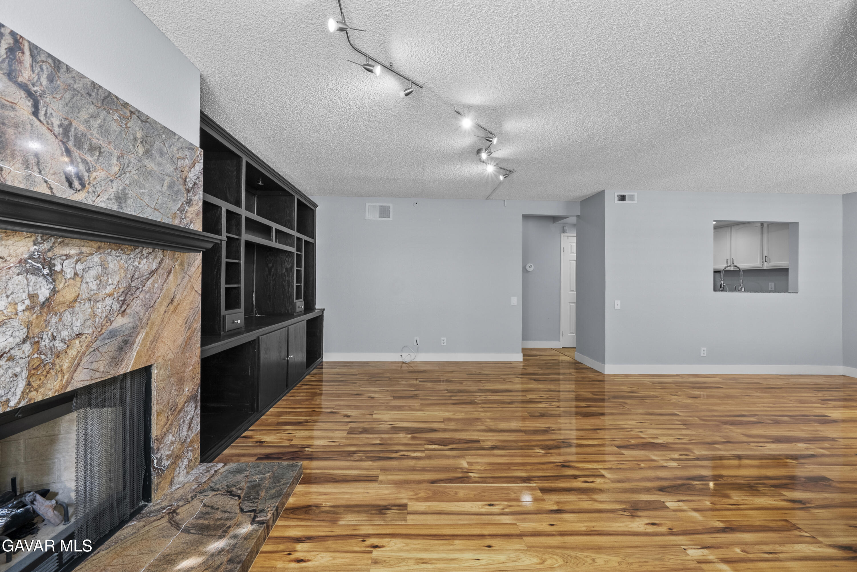 42805 15th Street West Lancaster, CA 93534 - Photo 8 of 27 a view of empty room with wooden floor and fan