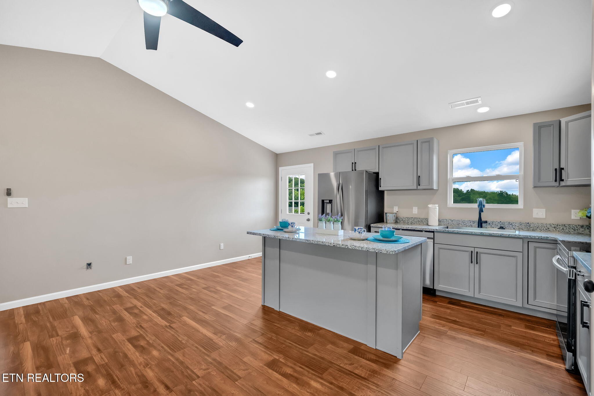 141 Middle Glen Road Maynardville, TN 37807 - Photo 12 of 41 a kitchen with stainless steel appliances granite countertop a stove and a sink