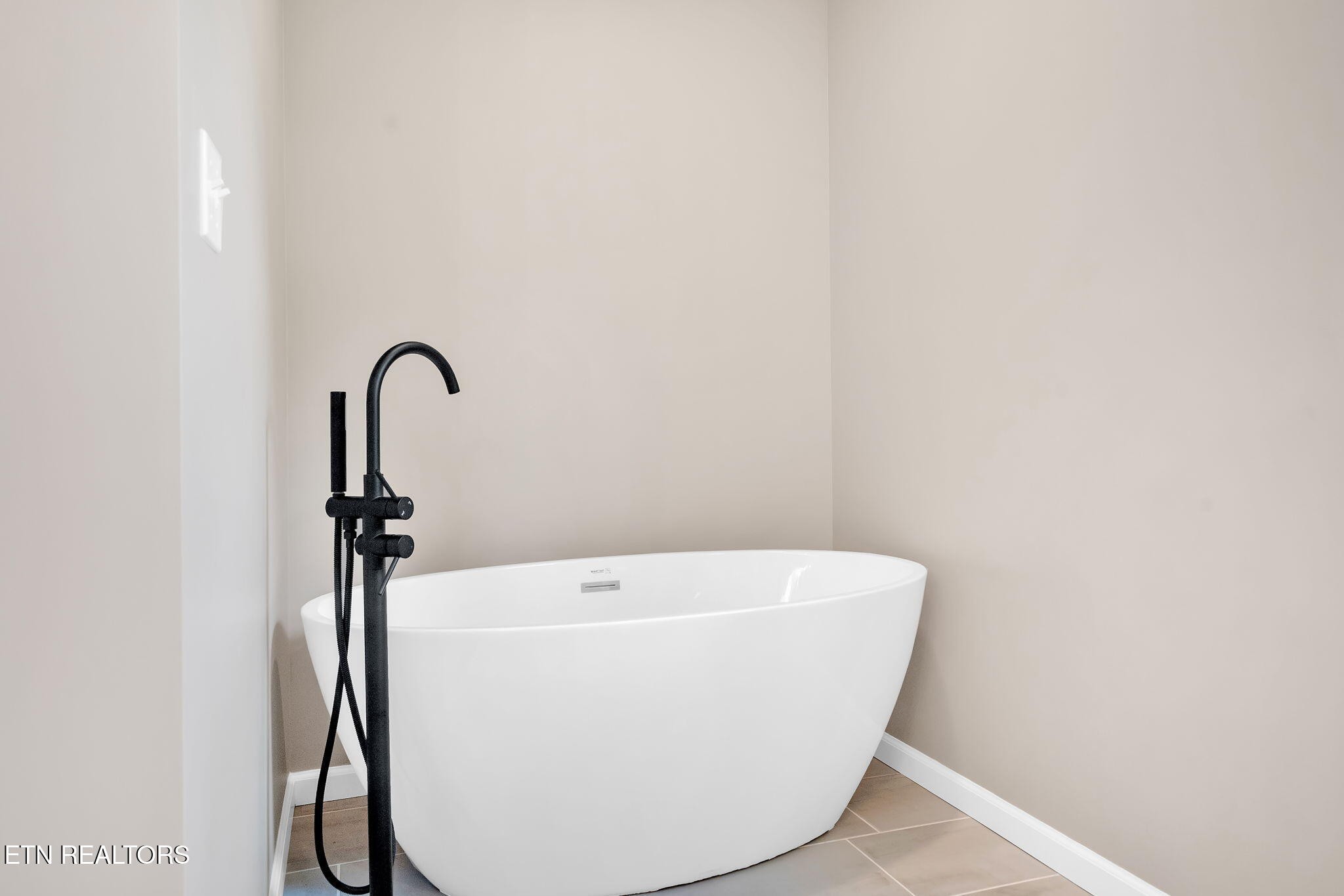 141 Middle Glen Road Maynardville, TN 37807 - Photo 24 of 41 a white bath tub sitting in a bathroom