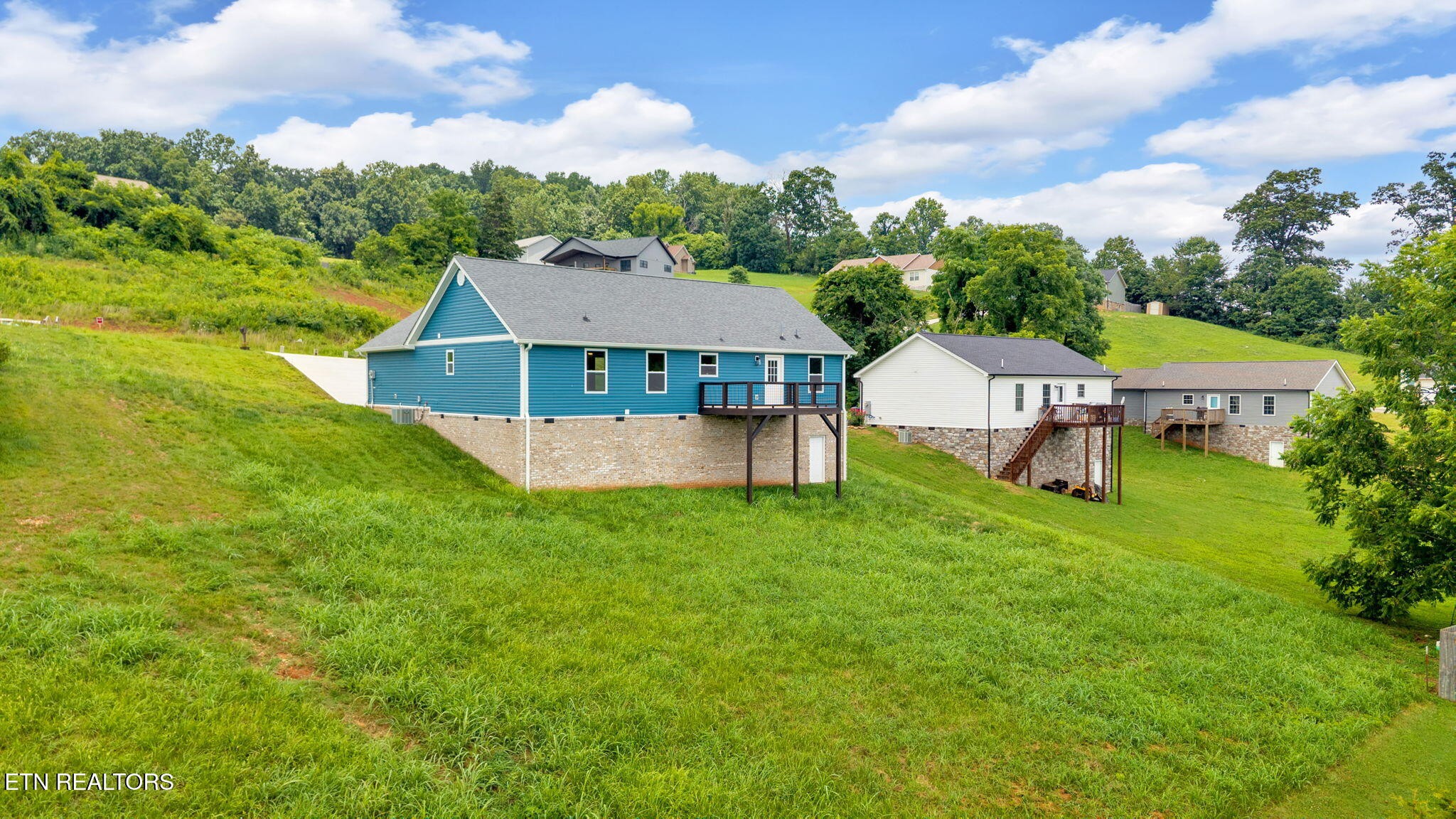 141 Middle Glen Road Maynardville, TN 37807 - Photo 36 of 41 a view of a house with a big yard and sitting area