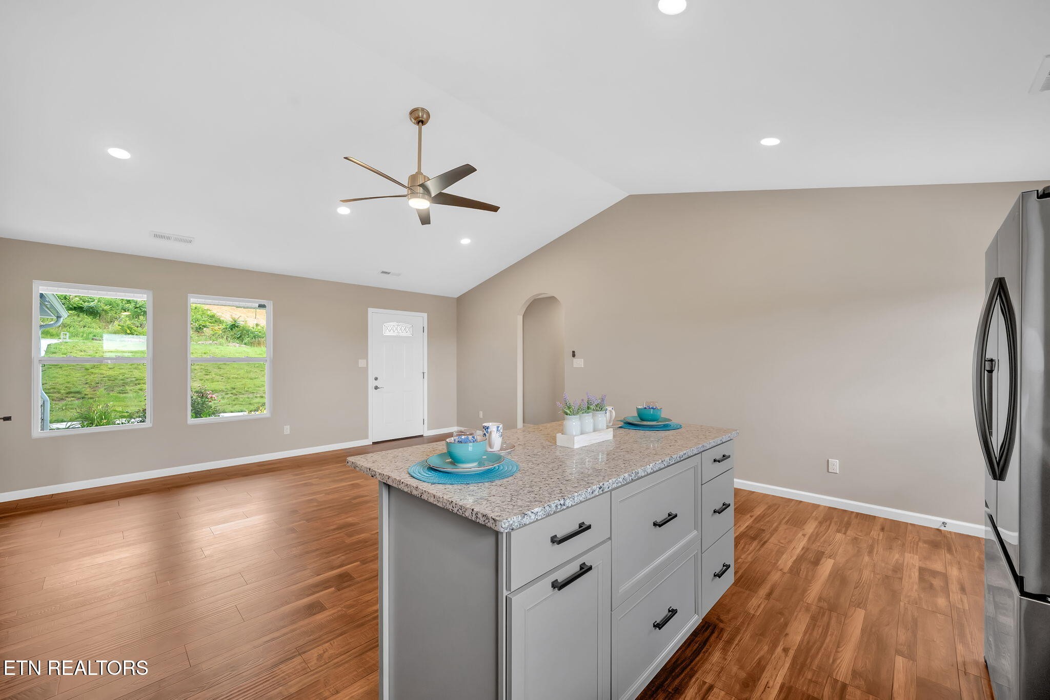 141 Middle Glen Road Maynardville, TN 37807 - Photo 9 of 41 a kitchen with stainless steel appliances granite countertop a sink cabinets and wooden floor