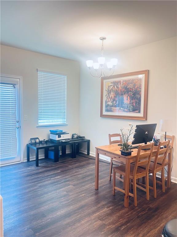 300 Harrison Street Calhoun, GA 30701 - Photo 4 of 17 a view of a dining room with furniture window and wooden floor