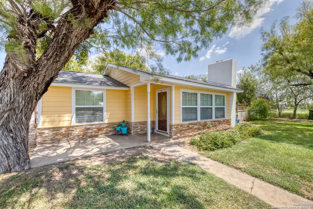 front view of a house with a yard