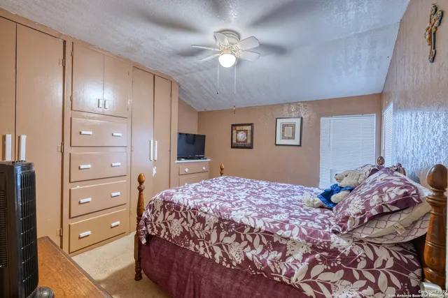 a bedroom with a bed and a dresser