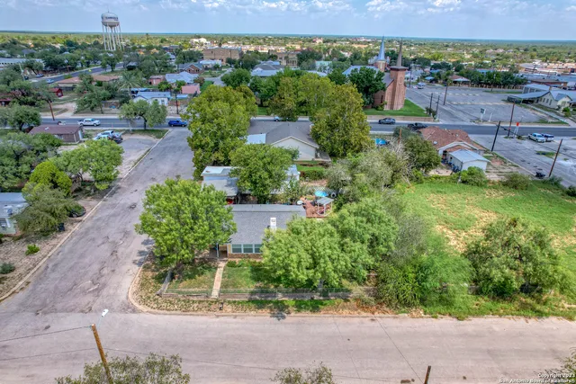 an aerial view of a house with a garden