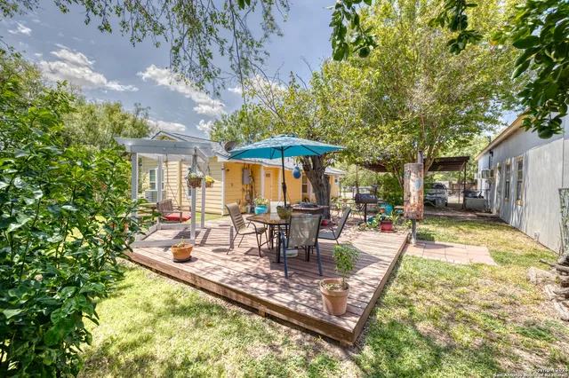 a view of a patio with swimming pool table and chairs