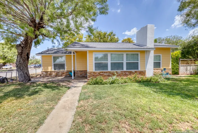 front view of a house with a yard