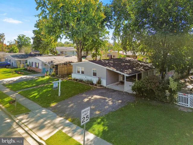 a view of a house with a yard porch and sitting area