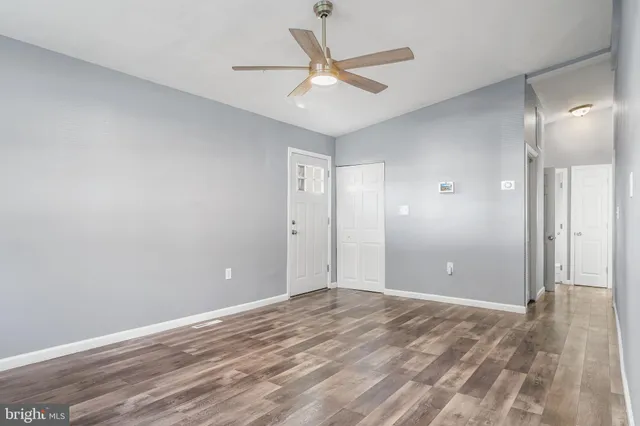 a view of a room with a ceiling fan