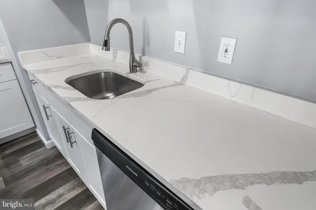 a kitchen with a sink and a stove