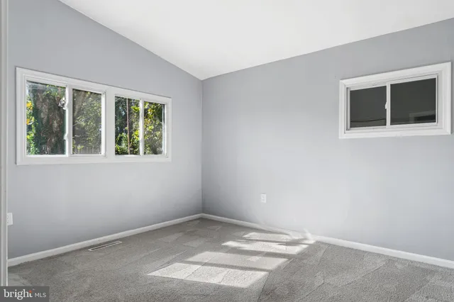 a view of empty room with windows