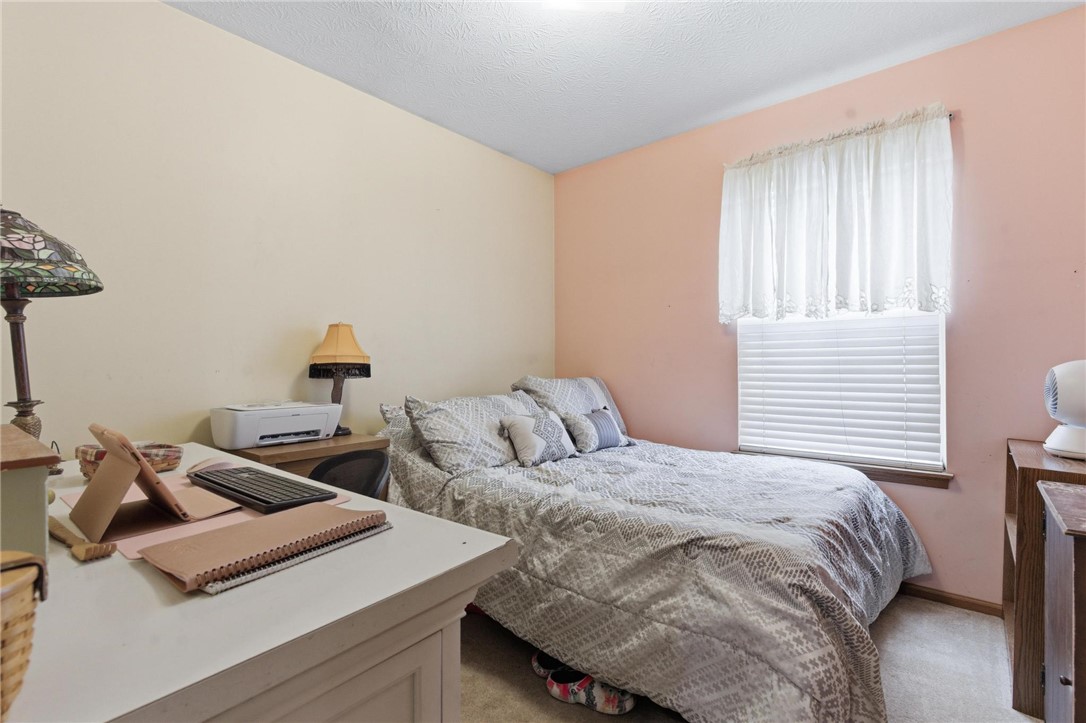 8747 Waynes Way Blanchester, OH 45107 - Photo 13 of 40 This cozy bedroom features a comfortable bed and ample space, ideal for rest and relaxation.