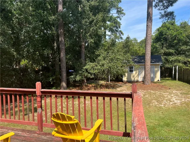 a view of a two chairs on the roof deck