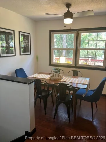 a view of a dining room with furniture window and outside view