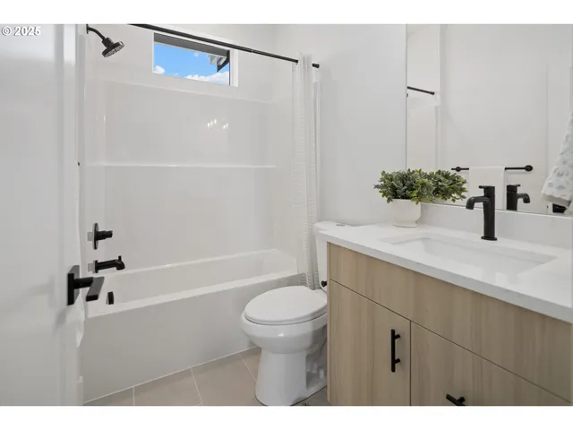 a view of a dining room with a table and chairs