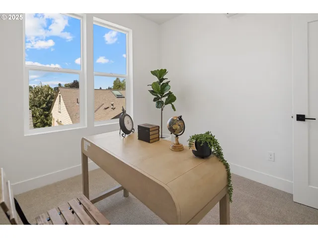 a view of a backyard with wooden fence