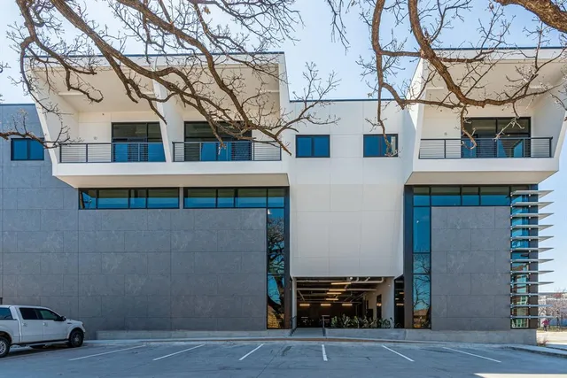 a kitchen that has a refrigerator a sink and a stove