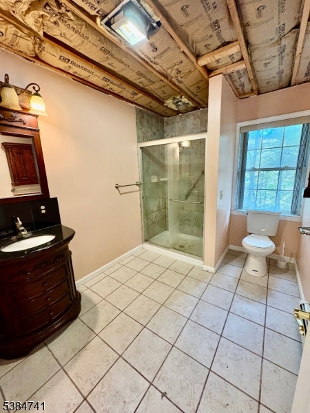 5327 Berkshire Valley Road, Unit 5 Oak Ridge, NJ 07438 - Photo 12 of 32 a living room with a couch