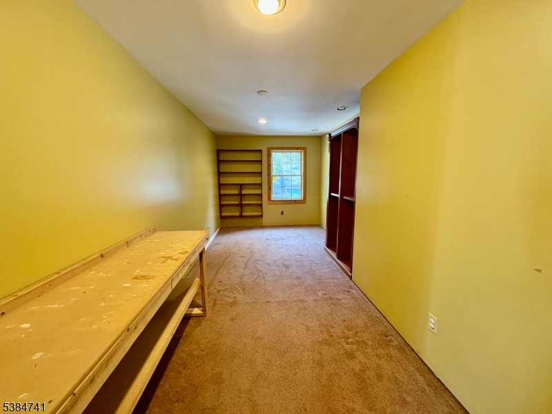 5327 Berkshire Valley Road, Unit 5 Oak Ridge, NJ 07438 - Photo 18 of 32 a view of an empty room with a window