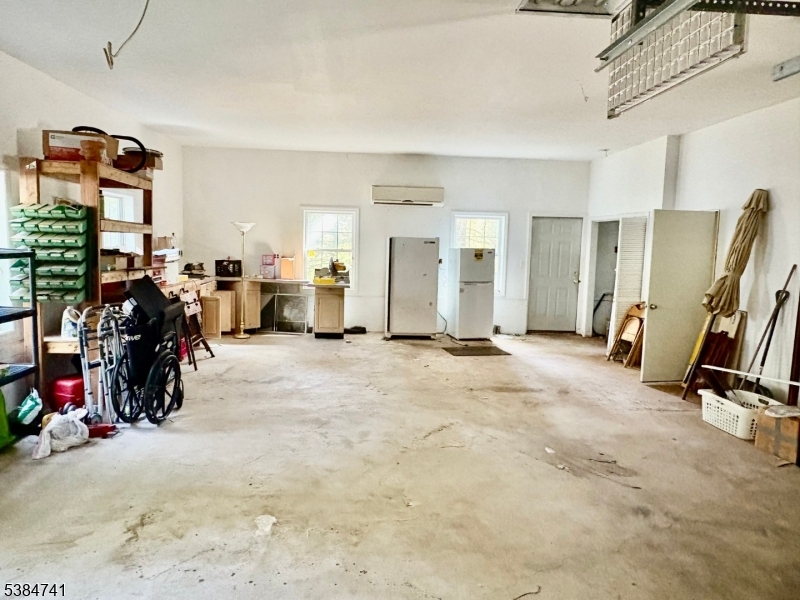 5327 Berkshire Valley Road, Unit 5 Oak Ridge, NJ 07438 - Photo 22 of 32 a view of a room with gym equipment