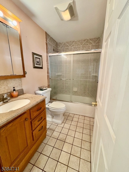 5327 Berkshire Valley Road, Unit 5 Oak Ridge, NJ 07438 - Photo 9 of 32 a bathroom with a sink a toilet and shower