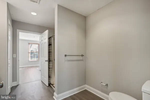 a bathroom with a shower and a toilet