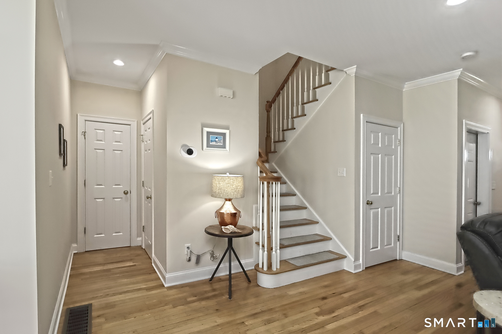 102 Lantern Court, Unit 102 Clinton, CT 06413 - Photo 19 of 36 a view of entryway with wooden floor