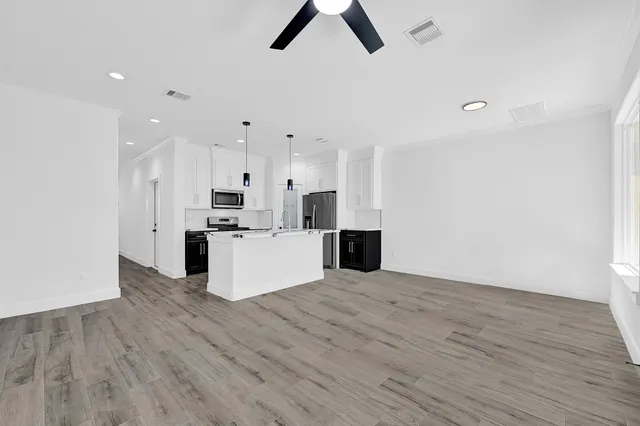 a view of kitchen with wooden floor