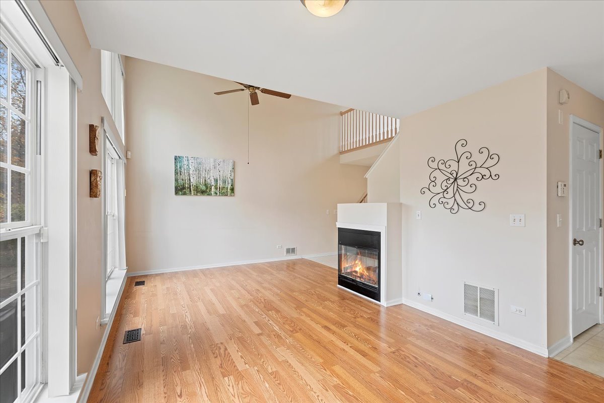 962 Willow Street Itasca, IL 60143 - Photo 11 of 33 a view of empty room with wooden floor and fan