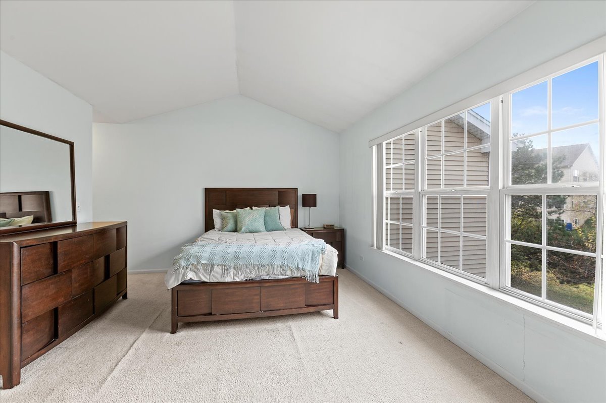 962 Willow Street Itasca, IL 60143 - Photo 23 of 33 a bedroom with a bed and a large window