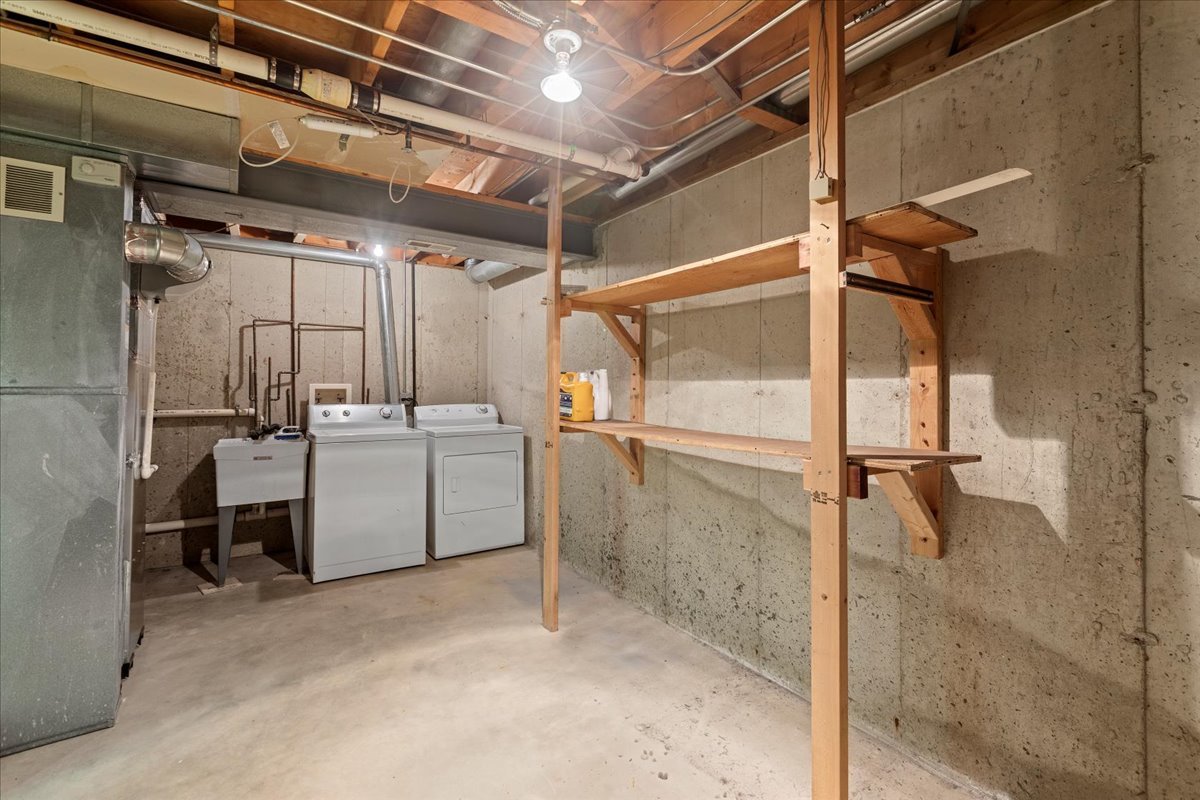 962 Willow Street Itasca, IL 60143 - Photo 29 of 33 a utility room with cabinets and washer