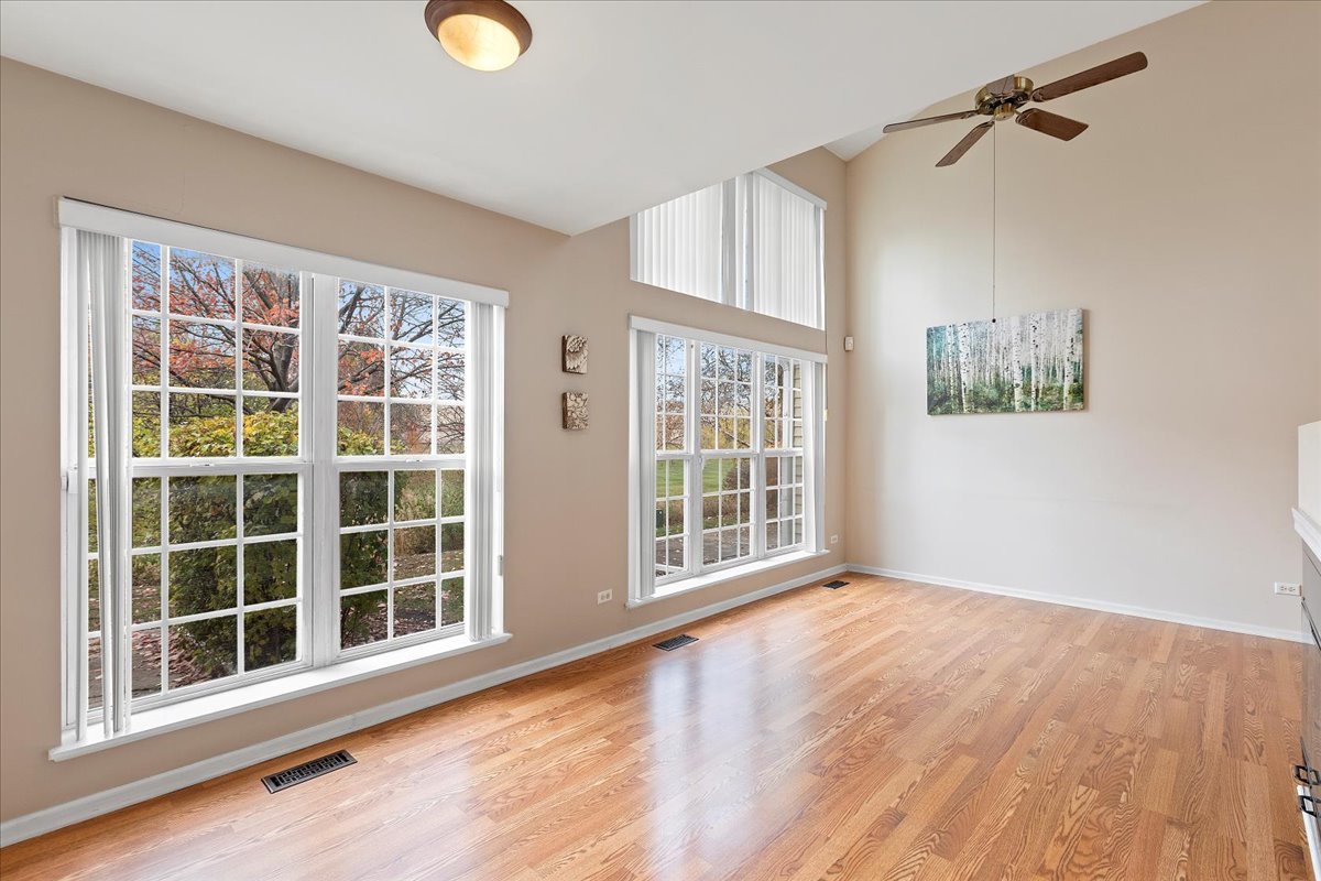 962 Willow Street Itasca, IL 60143 - Photo 10 of 33 an empty room with wooden floor and windows