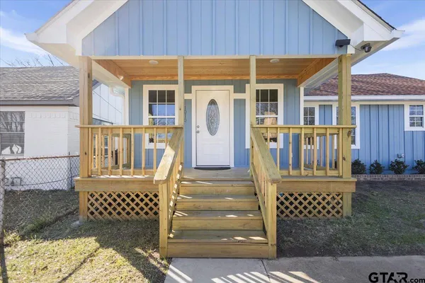 a front view of a house with a porch