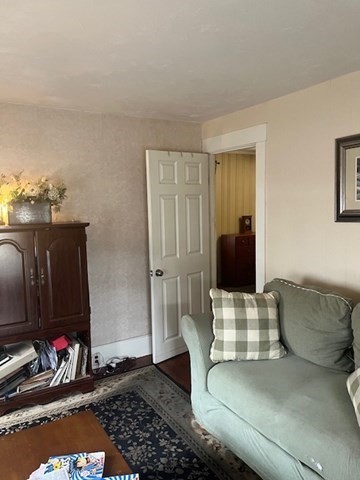 8 Grove Street Ayer, MA 01432 - Photo 11 of 20 a living room with furniture and a flat screen tv