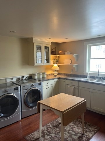 8 Grove Street Ayer, MA 01432 - Photo 5 of 20 a kitchen with a sink a stove and a microwave